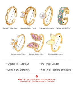 Detailed view of seven butterfly and pearl gold-tone open rings with dimensions.