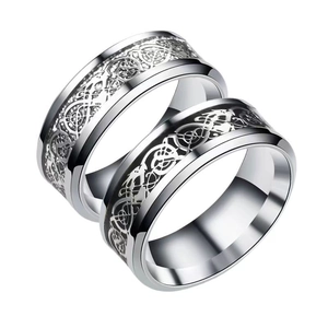 Pair of 8mm polished stainless steel rings featuring an intricate black dragon pattern