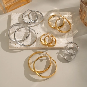 Polished gold and silver stainless steel hoop earrings set in various sizes for women
