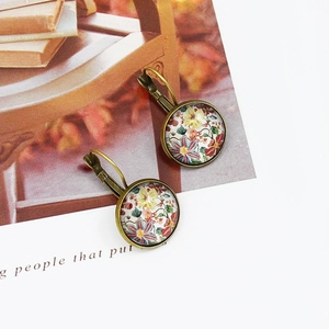 Vintage floral drop earrings with red heart diamond studs in antique bronze finish