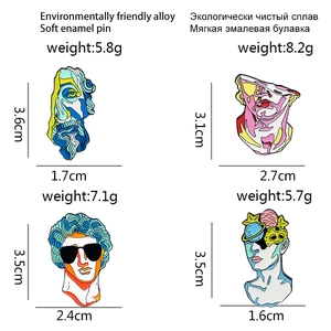 Creative abstract gypsum bust alloy brooches with planet and sunglasses design on white background