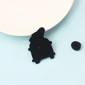Cartoon travel bus enamel brooch with back view showing black metal and rubber clutch