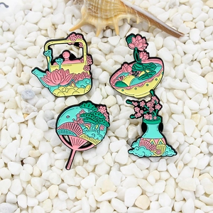 Set of 4 elegant enamel pins featuring lotus flower teapot and oriental fan designs