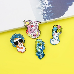Artistic abstract plaster sculpture enamel brooches in colorful styles on yellow background
