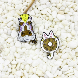 Cartoon enamel pin set with punk hippo and cat chocolate donut on white stones