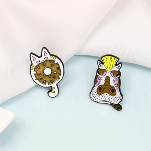 Cartoon enamel pins set featuring a white cat with a donut and a hippo with a mohawk