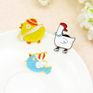 Cartoon animal enamel pins set with yellow duck white swan and blue bird on white plate