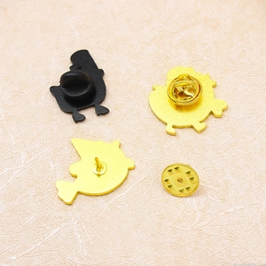 Back view of enamel animal brooches with metal butterfly clutch and rubber pin backings