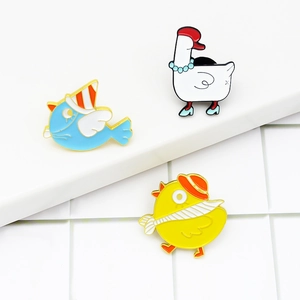 Cartoon circus animal enamel pins featuring white goose, yellow chick and blue bird