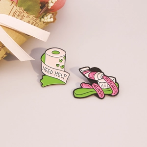 Creative enamel pins set featuring heart toilet paper and toothpaste in cartoon style