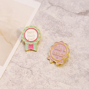 Floral ribbon enamel pins with 'BEST mum EVER' and 'like a mother' inscriptions
