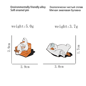 Detail view of cartoon goose enamel pins with precise dimensions and weight specs