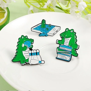 Three-piece set of cute cartoon green dinosaur enamel brooches reading and playing games