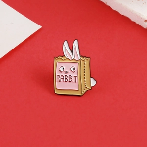 Cute cartoon white bunny in a brown paper bag enamel brooch pin on red background