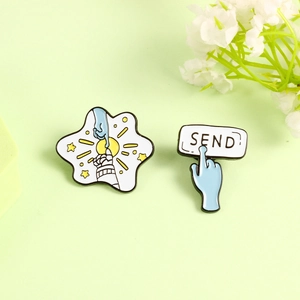Astronaut and alien fingertip touch enamel pins with SEND button on green background