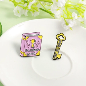 Creative pink book and yellow key enamel brooch set with floral patterns for dreamers