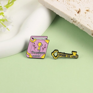Cartoon enamel brooch set with purple book and golden key designs for exploration
