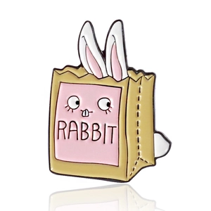 Cute cartoon white rabbit enamel brooch hiding in a paper shopping bag with reflection