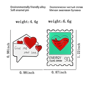 Macro view of heart envelope and stamp enamel pins with detailed size dimensions
