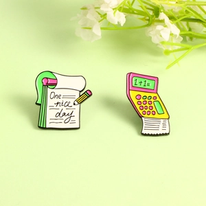 Calculator and notebook enamel pins set with One Nice Day text on light green background