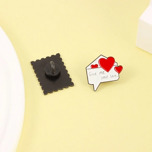 Enamel heart envelope brooch with Give me your love text and butterfly clutch back