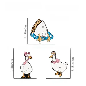 Detailed view of three cute duck enamel pins with dimensions and weight measurements