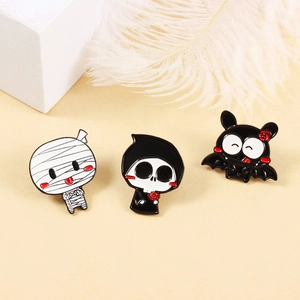 Three-piece Halloween enamel pin set featuring cute mummy, grim reaper, and bat figures