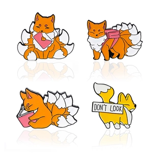 Set of four cute cartoon fox enamel pins featuring reading and humorous message motifs