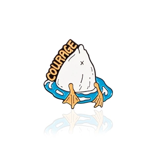 Funny cartoon duck diving into water enamel pin with Courage text and blue ripples