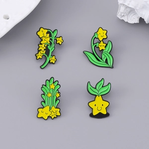 Lot de broches émaillées fleurs et étoiles avec visages souriants et plantes vertes