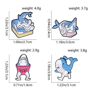 Detailed view of four ocean animal enamel pins with exact dimensions and weights