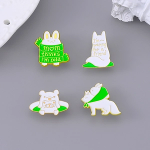 Set of four cute animal enamel pins featuring a rabbit and fox in winter scarves