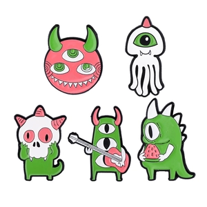 Set of 5 funny cartoon monster enamel pins including guitar monster and dinosaur