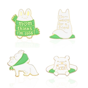Set of four cute animal enamel pins featuring rabbit and fox with winter scarves