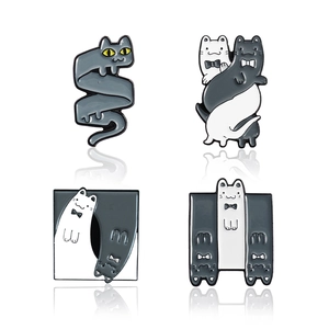 Cartoon yoga cat enamel pins set featuring gray and white cats in unique intertwined designs