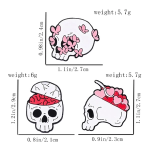 Detailed size chart for pink butterfly skull and heart candy enamel pins showing weight and dimensions