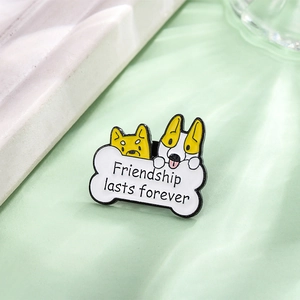 Cartoon dog enamel pins with friendship bone base on a soft green background