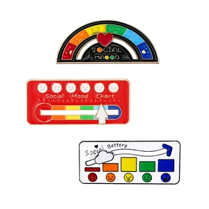 Three creative enamel pins featuring social mood charts and social battery designs