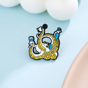 Macro shot of a cartoon octopus enamel pin with microphone and blue wine bottle