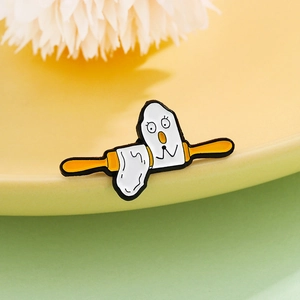 Cartoon egg ghost enamel pin with yellow rolling pin on creative breakfast scene