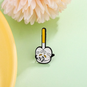 Cartoon enamel brooch featuring two hugging white figures with a yellow long pole background