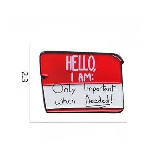Detail of red enamel greeting pin made of eco-friendly alloy with creative lettering