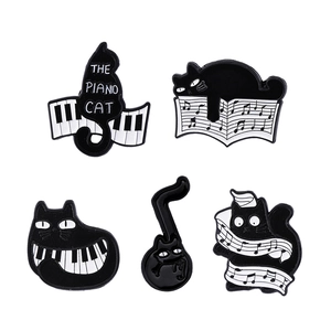 Set of 5 cartoon black cat enamel pins featuring piano keys and musical notes