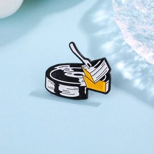 Punk skeleton hand with record vinyl and yellow cake enamel pin for creative fashion styling
