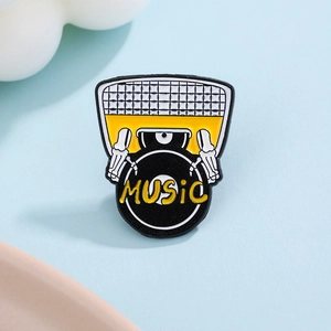 Detail shot of punk skull hands DJing on a vinyl record enamel music pin