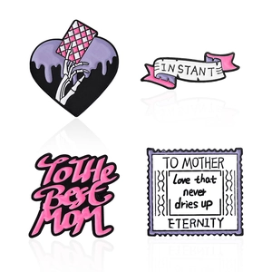 Set of four creative enamel pins featuring heart skull hand and To the Best Mom message