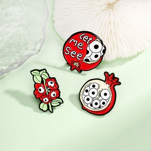Creative pomegranate and eyeball enamel pin set with Let Me See text for backpacks