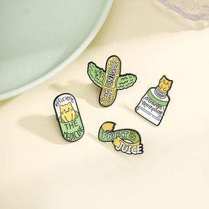 Whimsical cartoon enamel pins featuring cat toothpaste, cactus, and capsules on beige surface