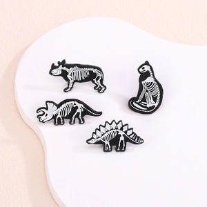 Creative dinosaur skeleton enamel pins set featuring triceratops and animal bone designs