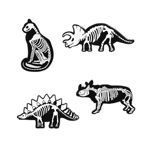 Creative dinosaur skeleton enamel pins set featuring triceratops and animal bones design